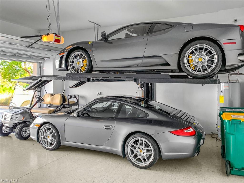 6552 Dominica Drive, Unit 101 Naples, FL 34113 - Photo 27 of 50 a car parked in a garage