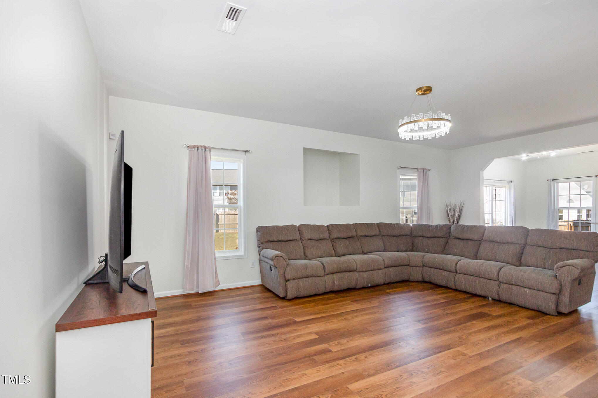 3934 Patriot Ridge Court Raleigh, NC 27610 - Photo 8 of 28 a living room with furniture and a flat screen tv