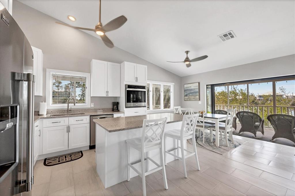 331 Bocilla Drive Boca Grande, FL 33921 - Photo 14 of 34 a view of a dining room with furniture window and outside view