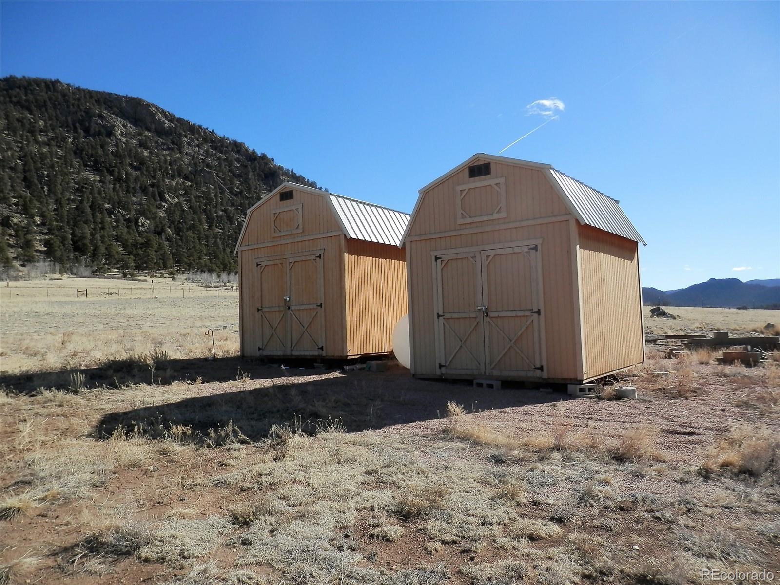 6763 Jefferson Road Hartsel, CO 80449 - Photo 8 of 32 a view of a dry yard with wooden fence