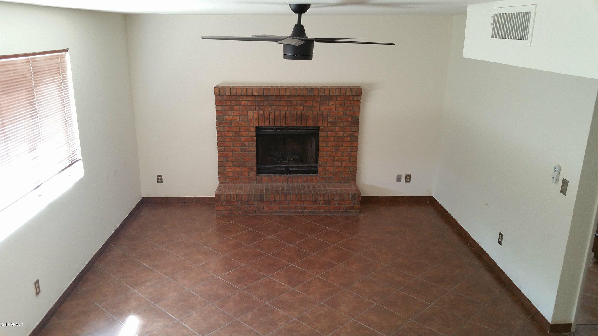4231 East Decatur Street Mesa, AZ 85205 - Photo 8 of 22 fire place in lower level