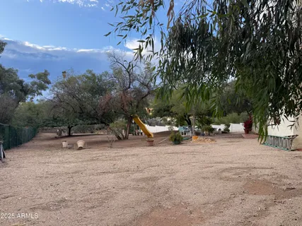 a view of a park with swings and slides