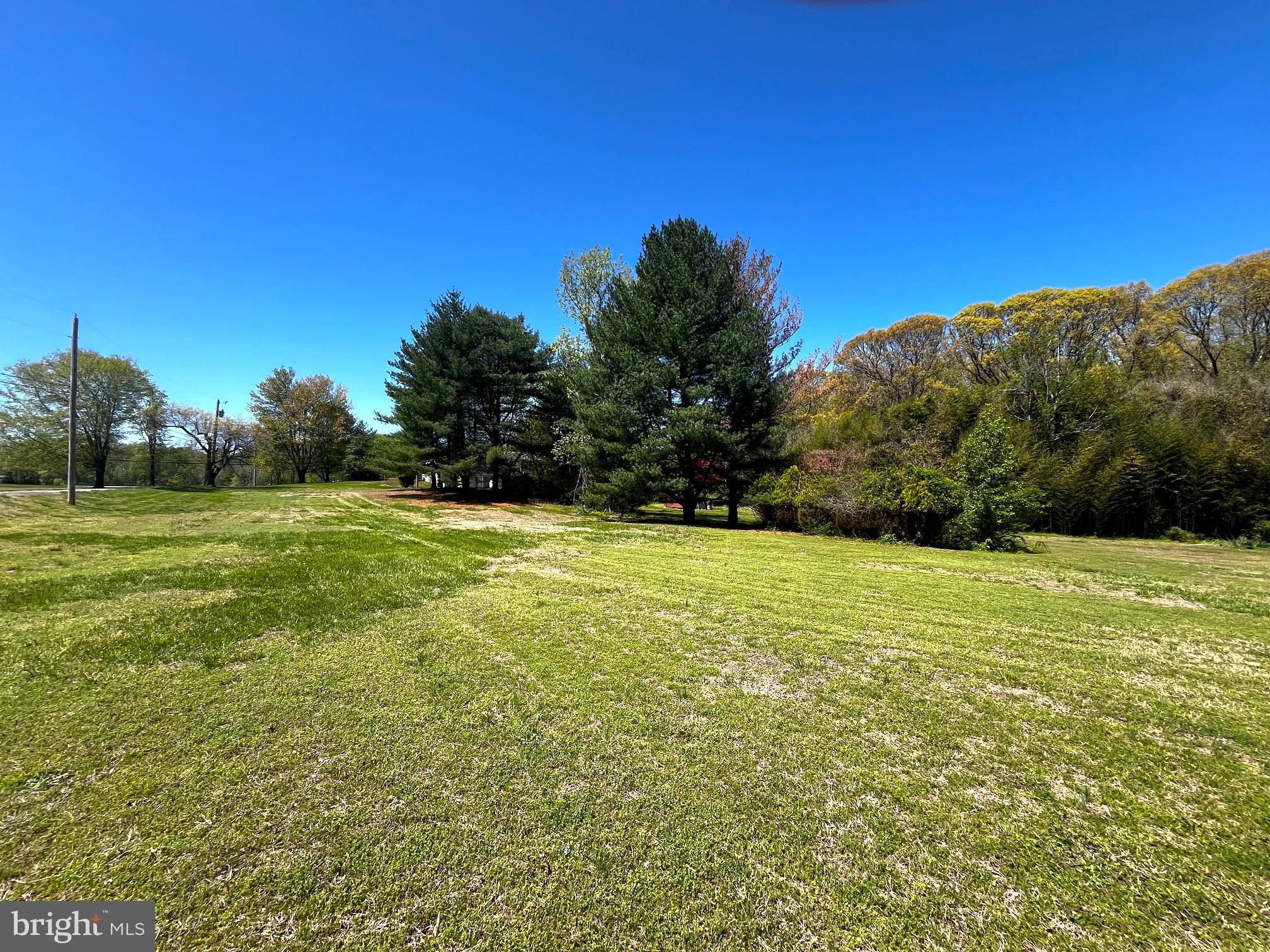 3820 Hallowing Point Road Prince Frederick, MD 20678 - Photo 20 of 23 a view of a field with an trees in the background
