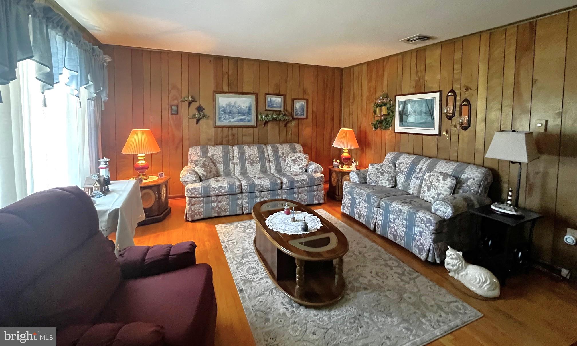 3820 Hallowing Point Road Prince Frederick, MD 20678 - Photo 6 of 23 a living room with furniture and a fireplace