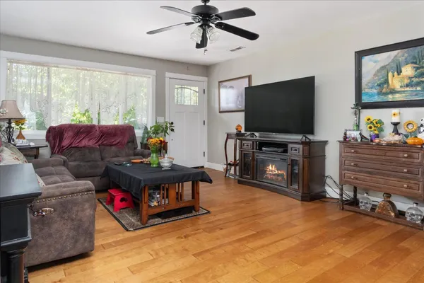 a living room with furniture and a flat screen tv