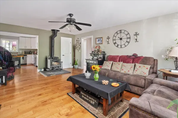 a living room with furniture a rug and a chandelier