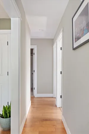 a view of an entryway with wooden floor