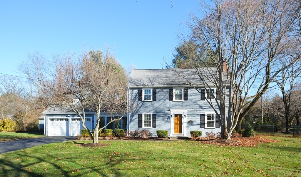 295 Concord Road Wayland, MA 01778 - Photo 1 of 30 a view of a white house with a big yard and large trees