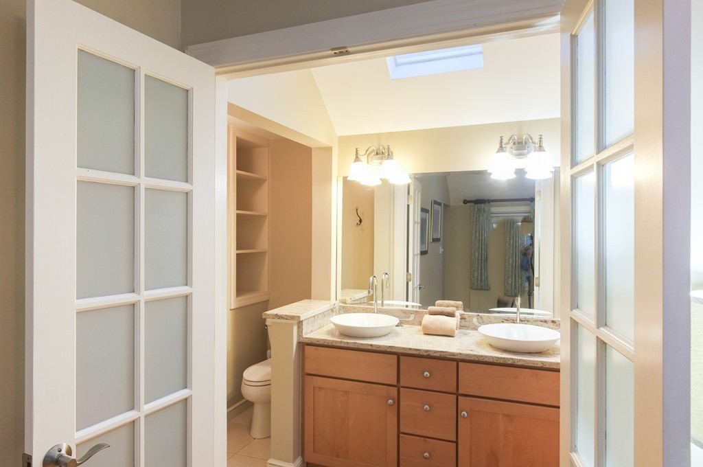 295 Concord Road Wayland, MA 01778 - Photo 17 of 30 a bathroom with a double vanity sink and a mirror
