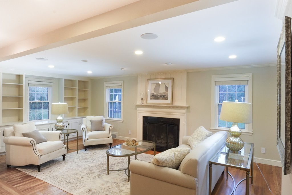 295 Concord Road Wayland, MA 01778 - Photo 2 of 30 a living room with furniture fireplace and a table