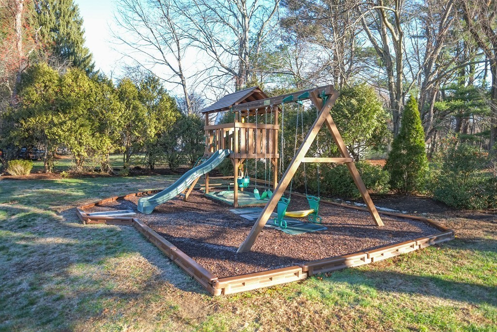 295 Concord Road Wayland, MA 01778 - Photo 27 of 30 a view of a backyard with a slide