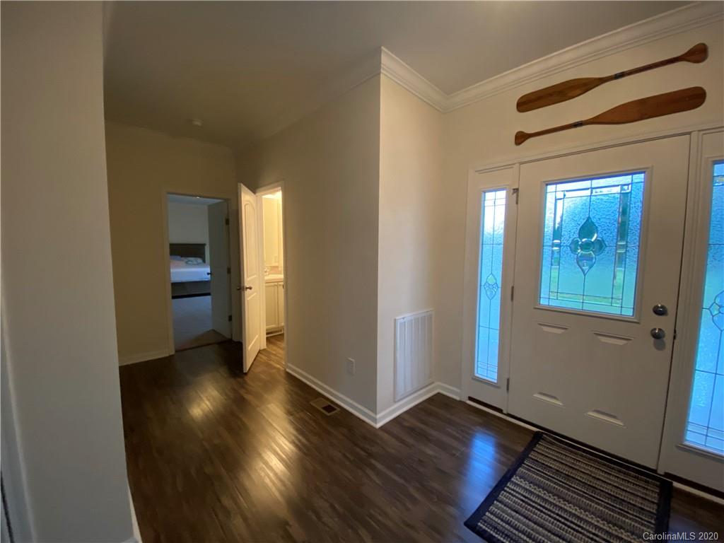 4009 Love Mill Road Monroe, NC 28110 - Photo 3 of 25 an empty room with wooden floor and windows