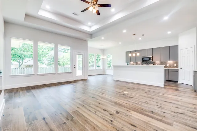 a view of kitchen with wooden floor and window