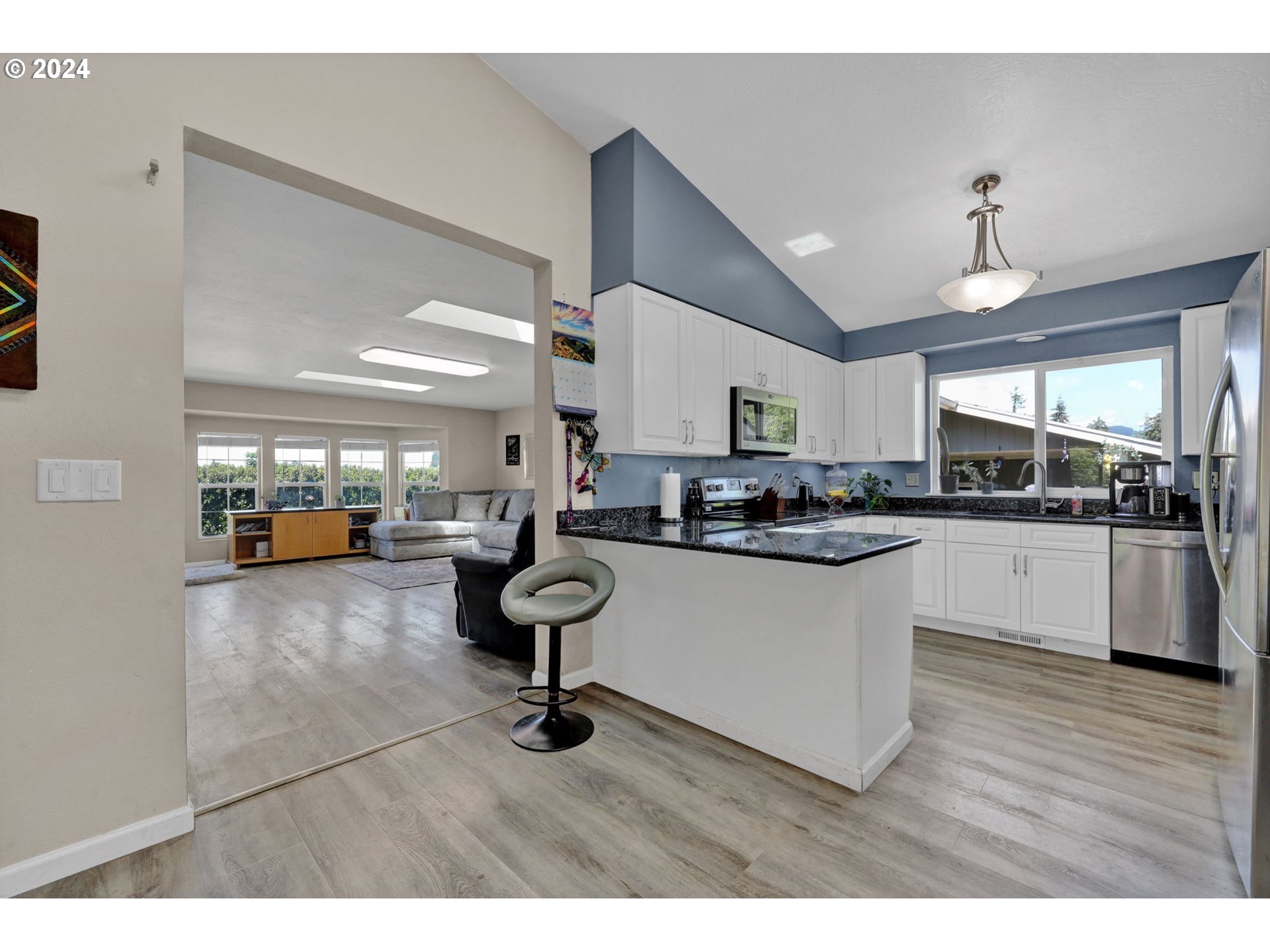 253 South 70th Place Springfield, OR 97478 - Photo 13 of 43 a kitchen with sink and refrigerator