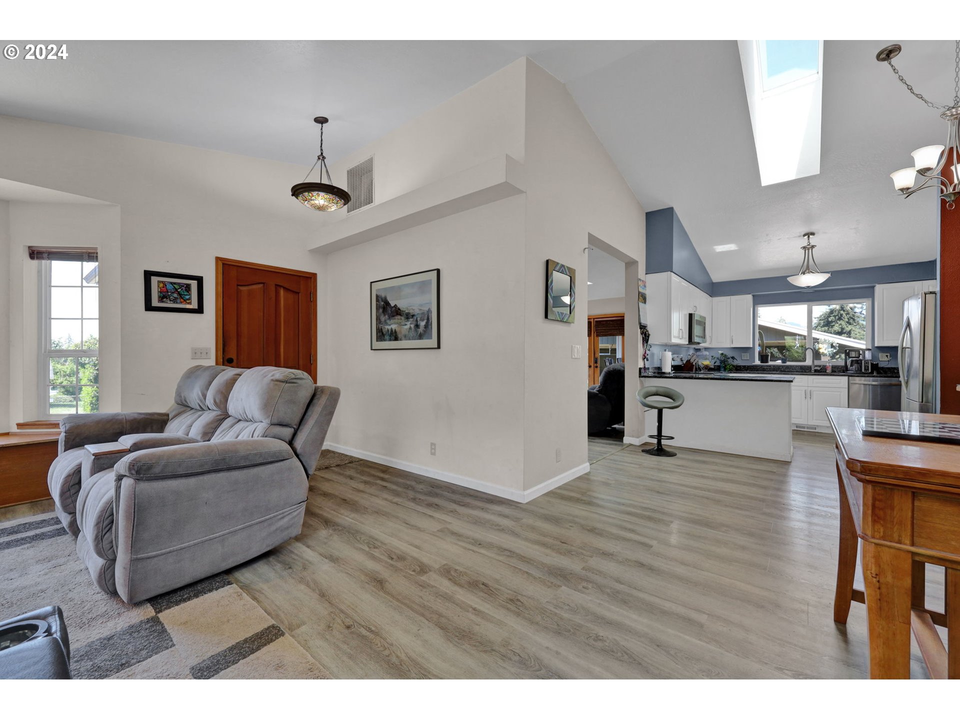253 South 70th Place Springfield, OR 97478 - Photo 20 of 43 a living room with furniture and kitchen view