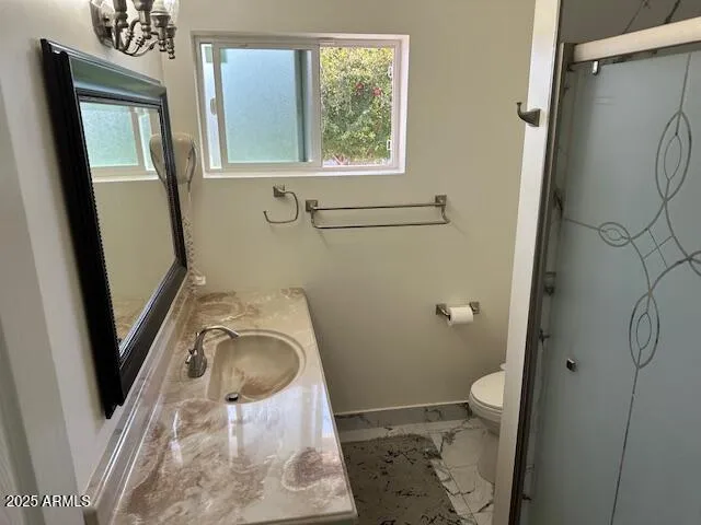 a bathroom with a toilet and a sink