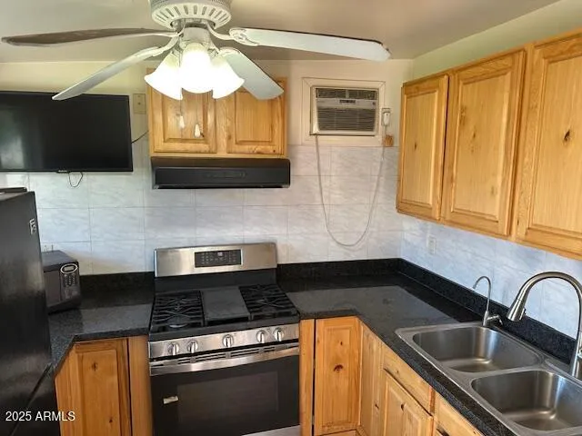 a kitchen with a stove and a microwave