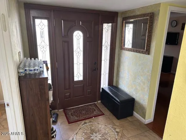 a view of front door with wooden floor