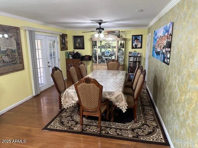a dining room with furniture a rug and wooden floor