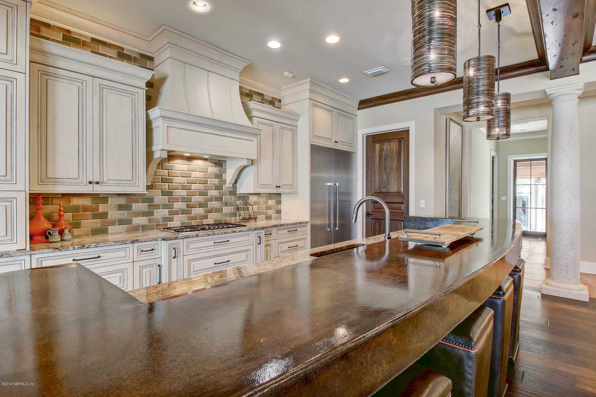1895 Bishop Estates Road Jacksonville, FL 32259 - Photo 15 of 102 a kitchen with kitchen island a sink and stove
