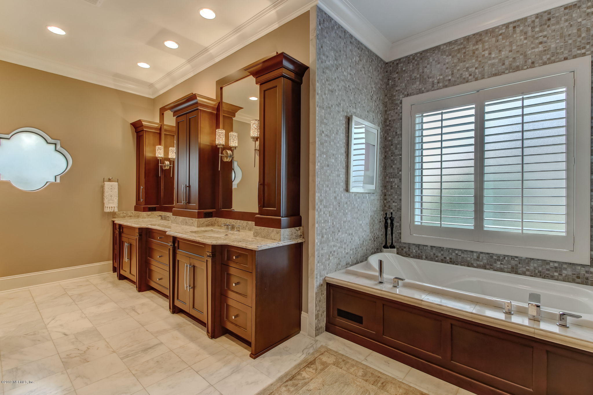 1895 Bishop Estates Road Jacksonville, FL 32259 - Photo 25 of 102 a spacious bathroom with a double vanity sink large mirror and a bathtub
