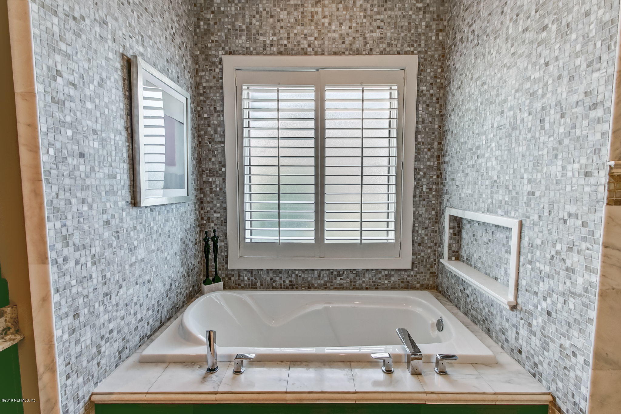 1895 Bishop Estates Road Jacksonville, FL 32259 - Photo 27 of 102 a bath tub sitting in a bathroom next to a window