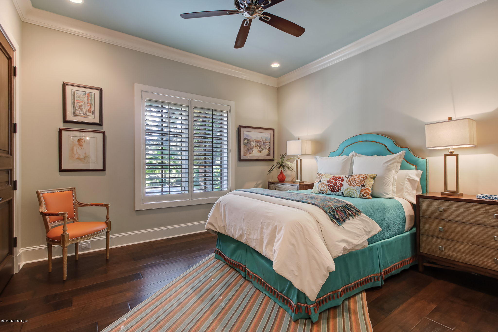 1895 Bishop Estates Road Jacksonville, FL 32259 - Photo 31 of 102 a bedroom with a bed a chair and a chandelier