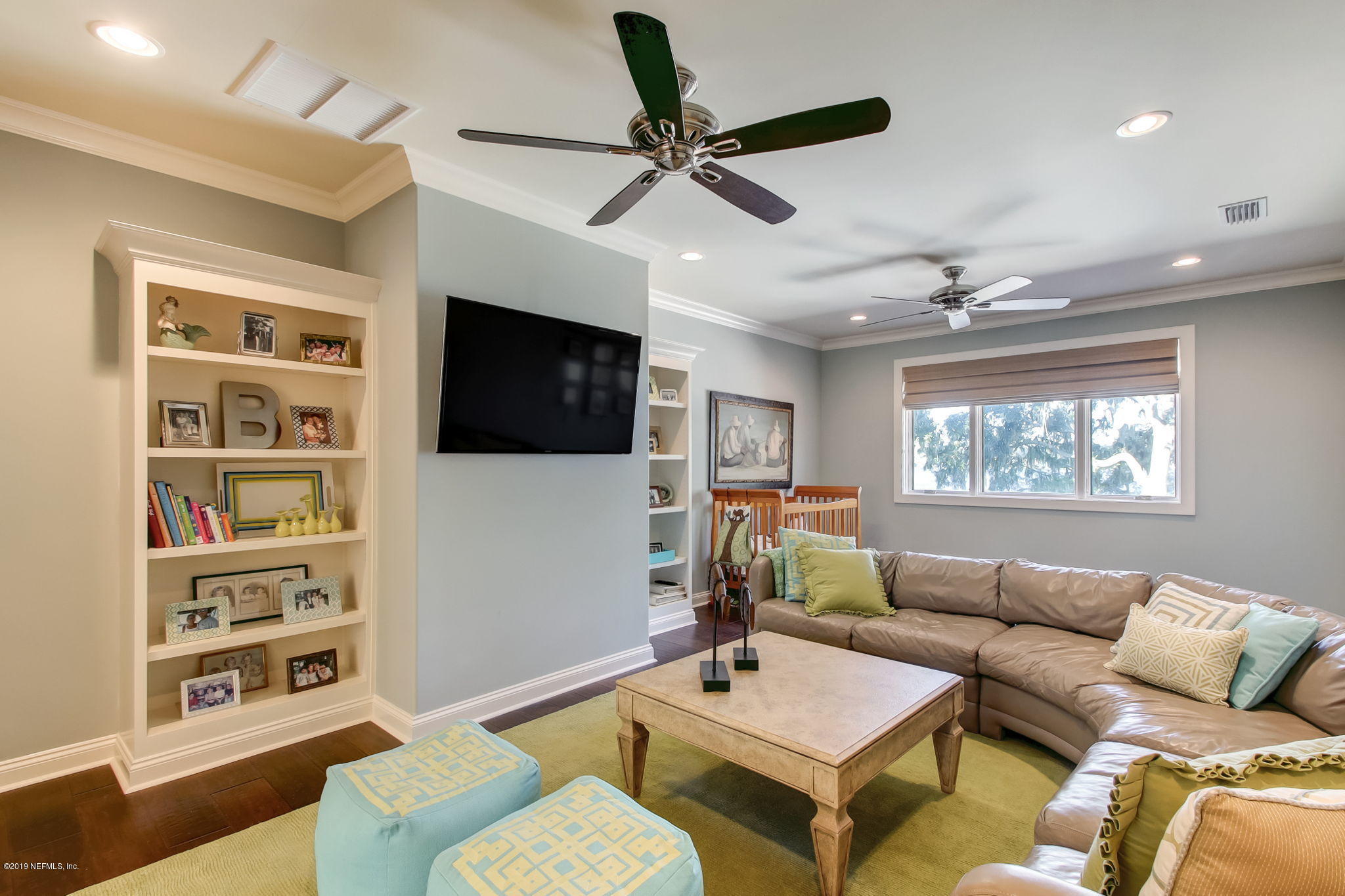 1895 Bishop Estates Road Jacksonville, FL 32259 - Photo 37 of 102 a living room with furniture a rug and a flat screen tv