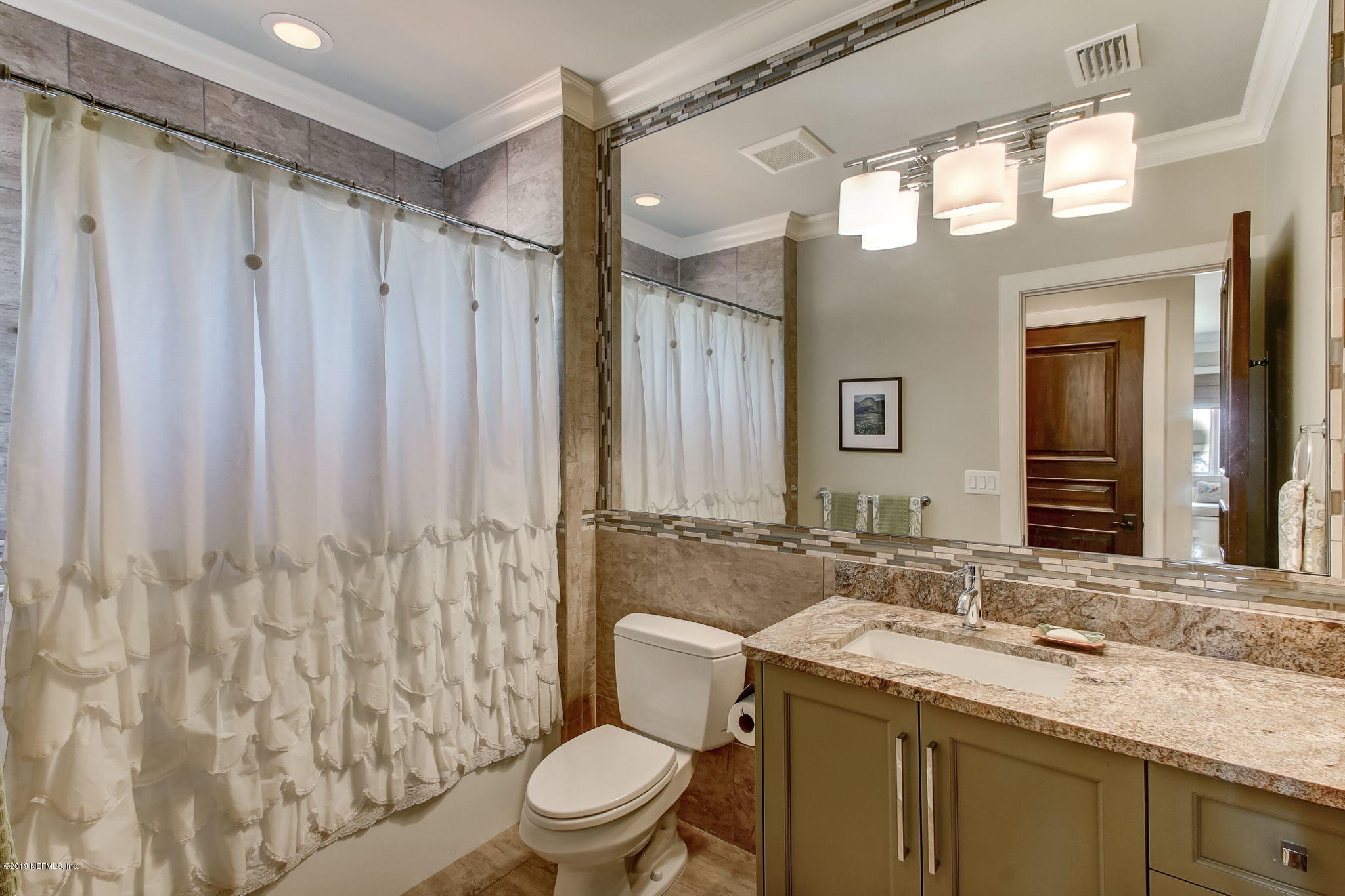 1895 Bishop Estates Road Jacksonville, FL 32259 - Photo 40 of 102 a bathroom with a granite countertop sink toilet and shower