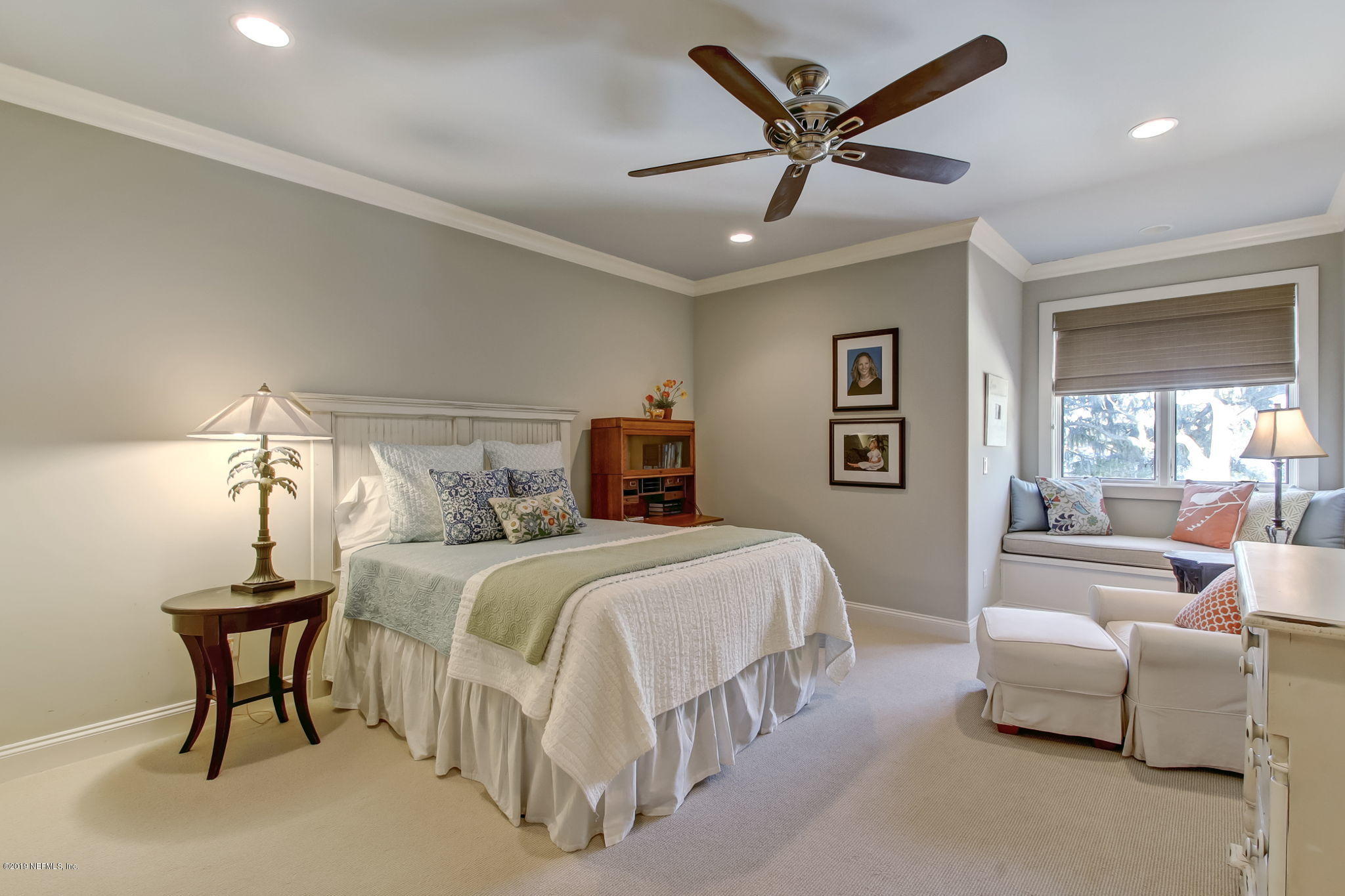 1895 Bishop Estates Road Jacksonville, FL 32259 - Photo 41 of 102 a bedroom with a bed and a chandelier