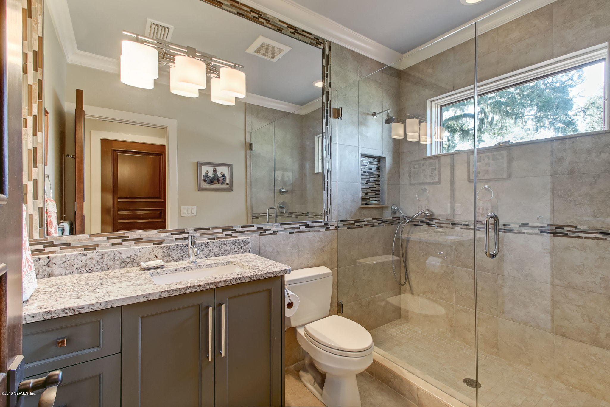 1895 Bishop Estates Road Jacksonville, FL 32259 - Photo 42 of 102 a bathroom with a granite countertop sink toilet and shower