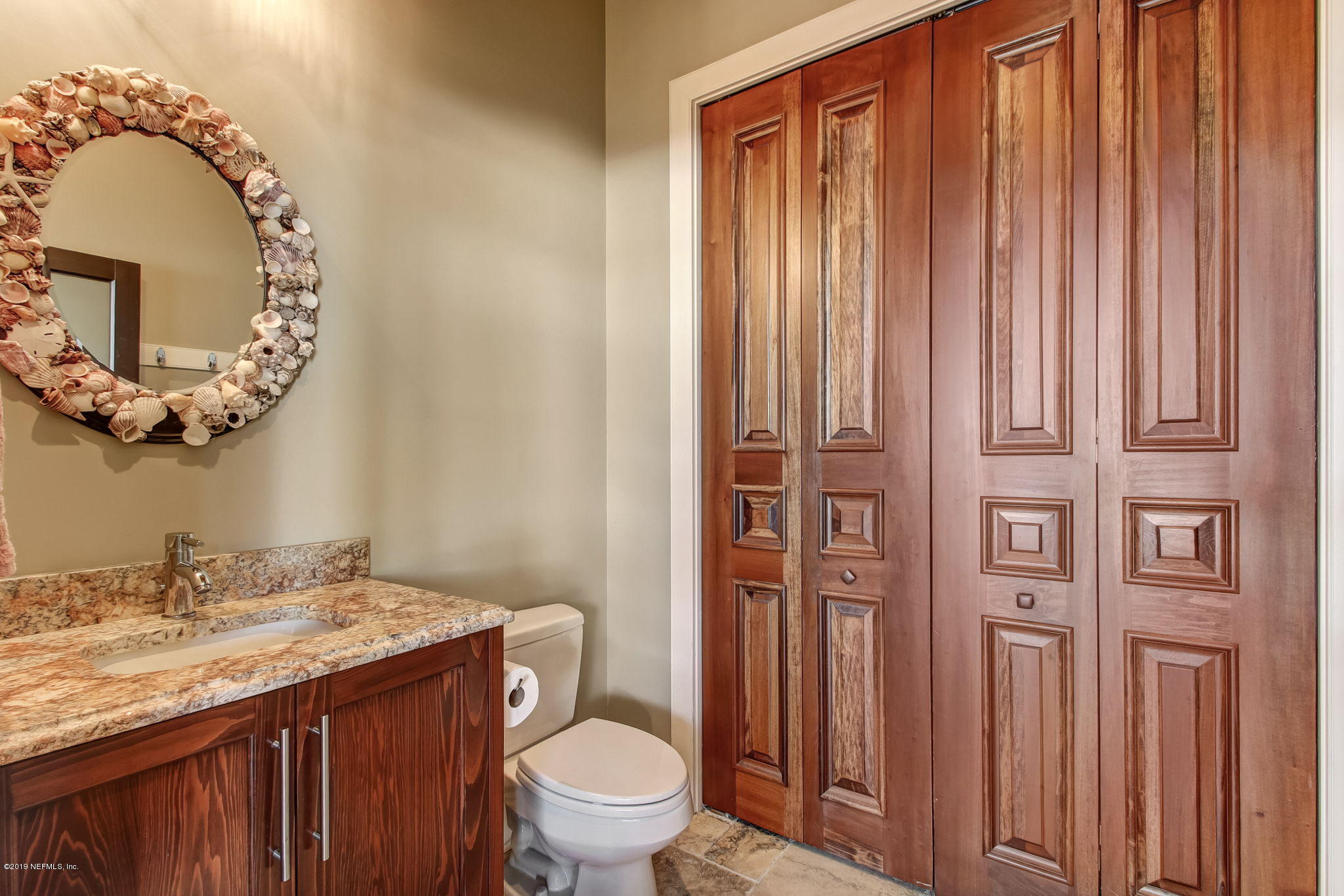 1895 Bishop Estates Road Jacksonville, FL 32259 - Photo 51 of 102 a bathroom with a granite countertop sink and a mirror