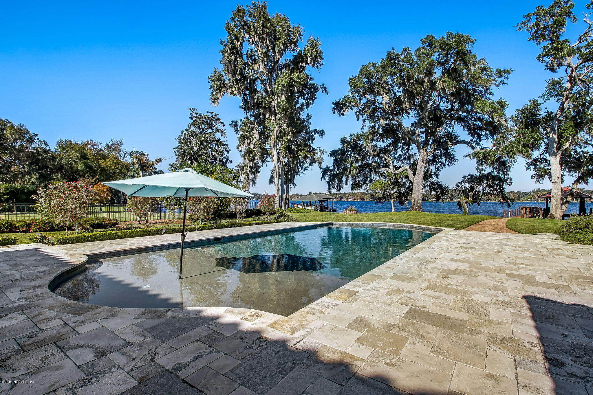 1895 Bishop Estates Road Jacksonville, FL 32259 - Photo 56 of 102 a view of a swimming pool with an outdoor space and seating area