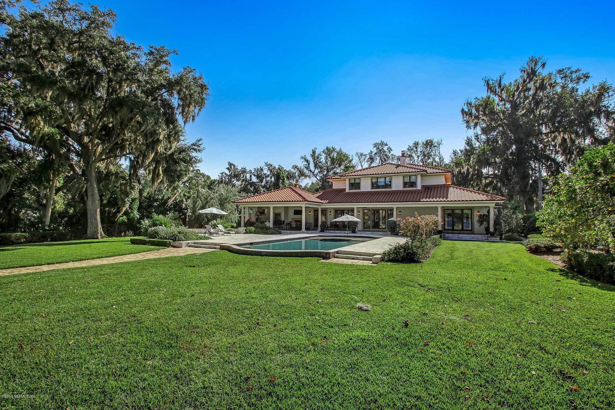 1895 Bishop Estates Road Jacksonville, FL 32259 - Photo 62 of 102 a view of a house with a big yard and large trees