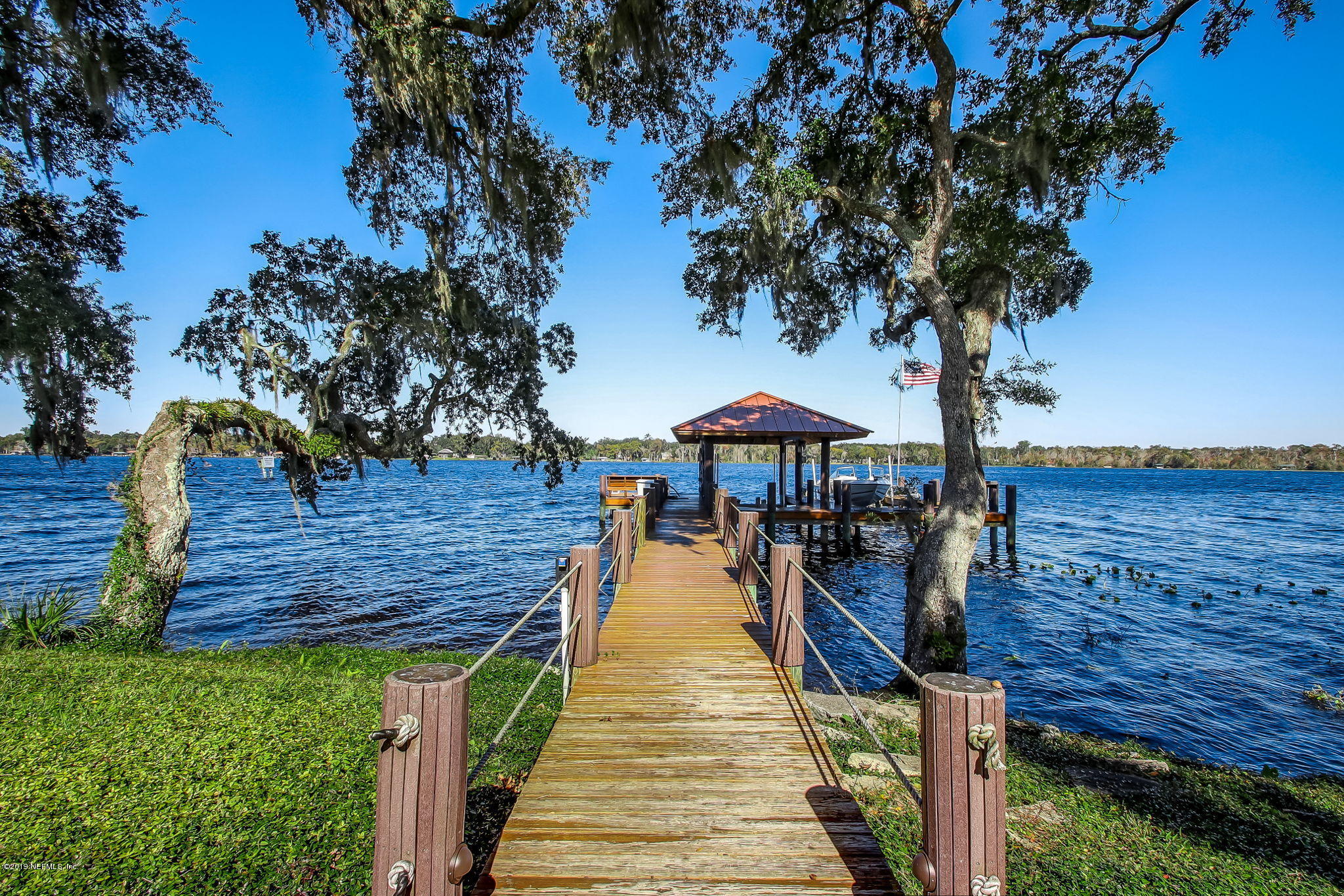 1895 Bishop Estates Road Jacksonville, FL 32259 - Photo 66 of 102 a group of people sitting on a deck in front of a house