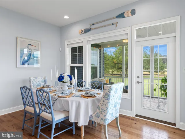 a spacious bathroom with a double vanity sink a mirror a bathtub and a shower