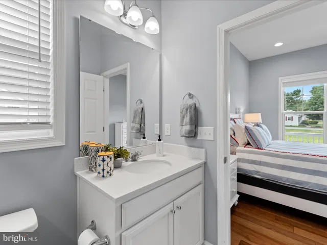 a view of a balcony with wooden floor and fence