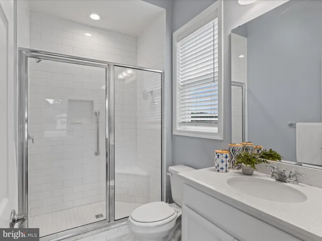 a bed room with two beds and a window