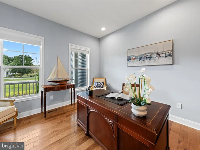 a bed room with a bed and a chair