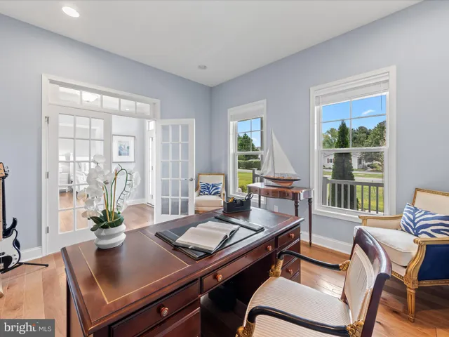 a bathroom with a sink vanity mirror and toilet