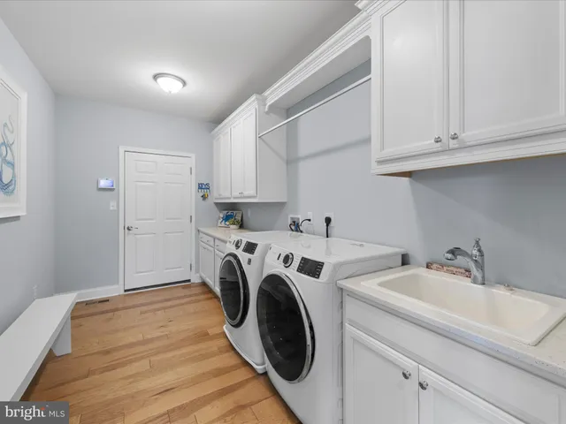 a bathroom with a sink a toilet and a curtain
