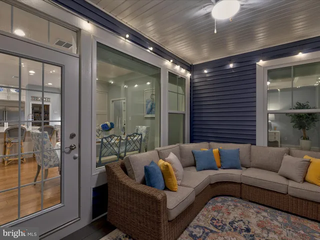 a bedroom with a bed lamp and a window