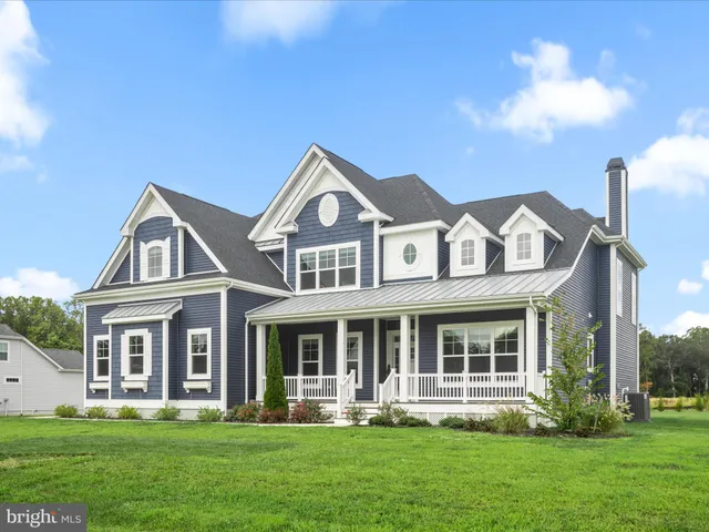 a large white kitchen with lots of counter space