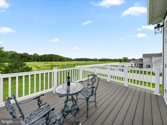 a view of a swimming pool with sitting area