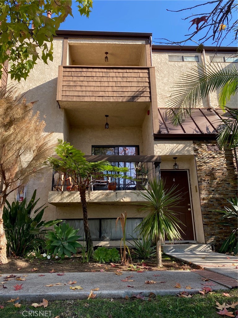 a front view of building with yard