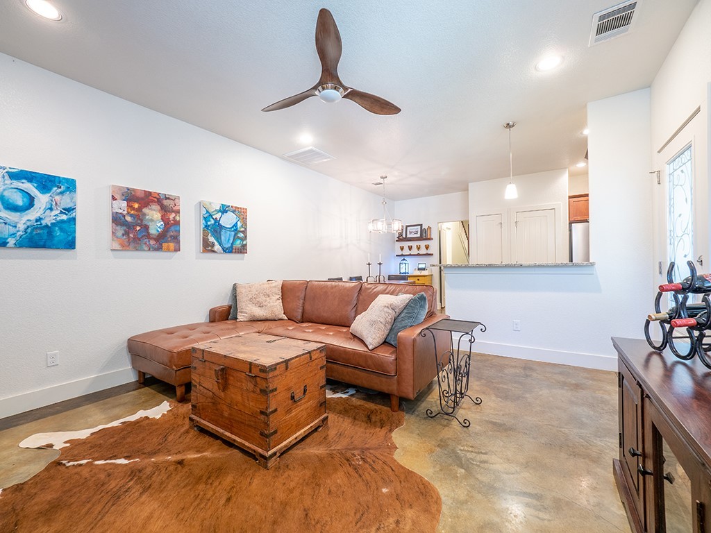 55 Tournament Way, Unit B The Hills, TX 78738 - Photo 13 of 23 a living room with furniture and wall paintings
