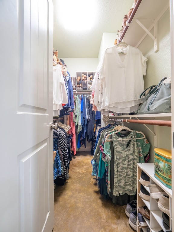 55 Tournament Way, Unit B The Hills, TX 78738 - Photo 17 of 23 a view of walk in closet with clothes and shoes