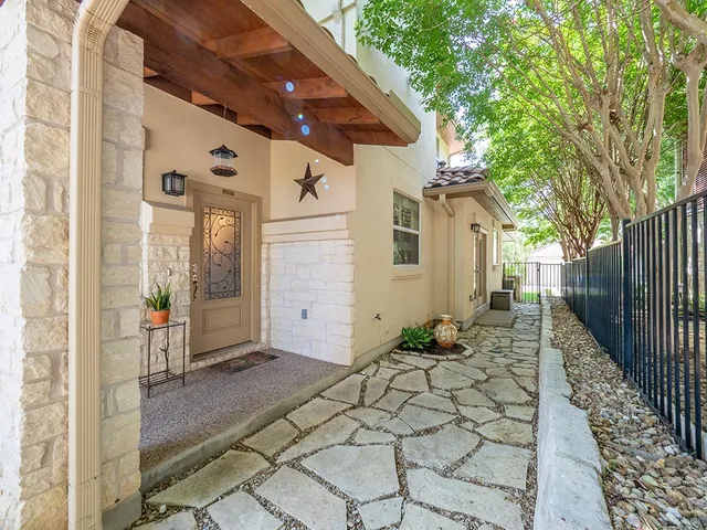 a kitchen with stainless steel appliances granite countertop a refrigerator and a stove