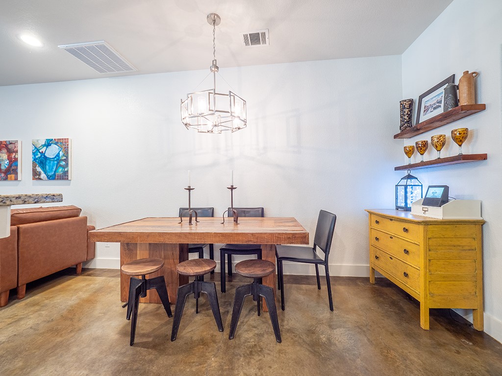 55 Tournament Way, Unit B The Hills, TX 78738 - Photo 9 of 23 a view of a dining room with furniture