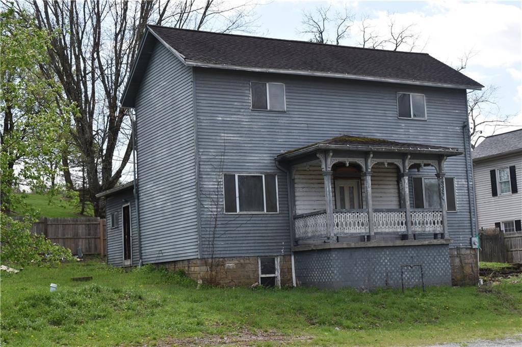 a brick house with a small yard